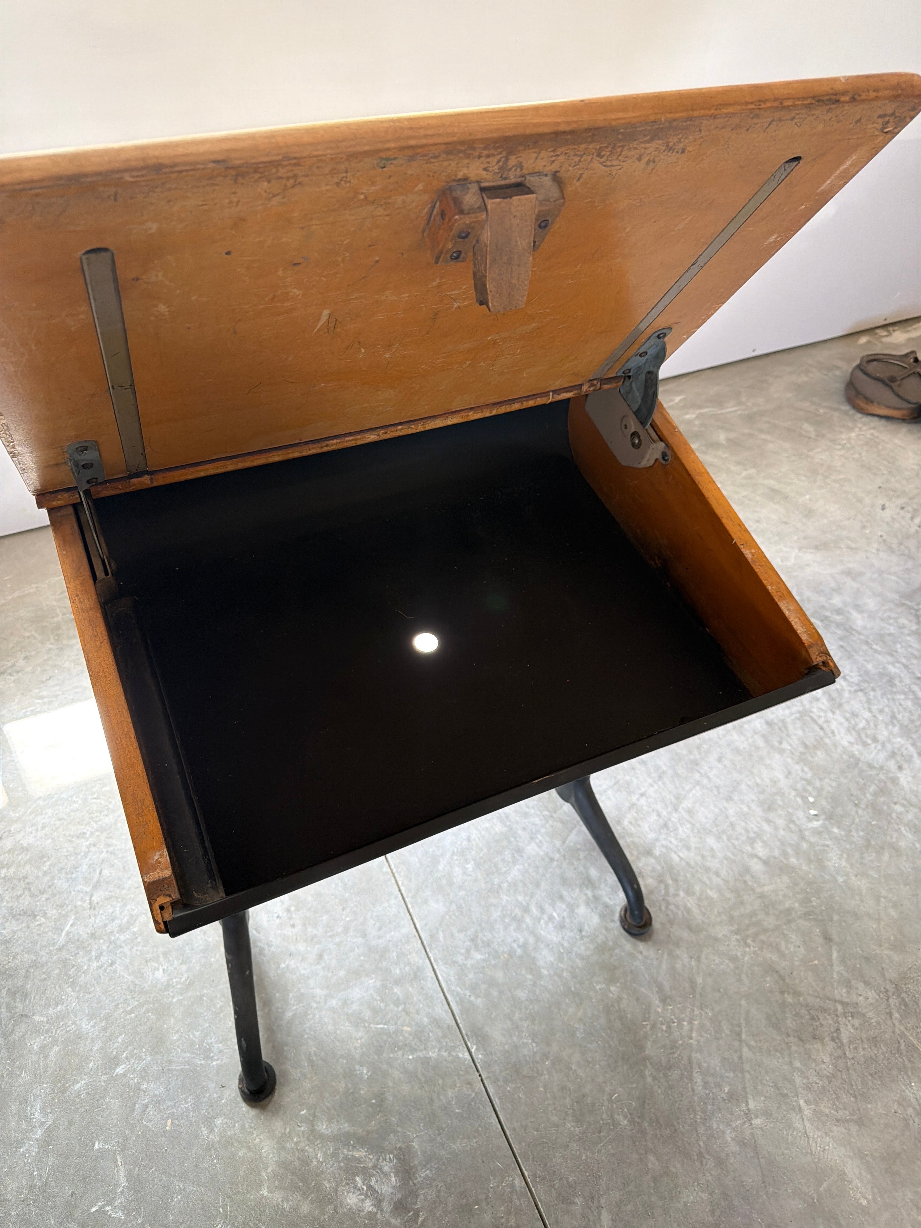 Vintage student desk with recessed metal trays and authentic institutional patina