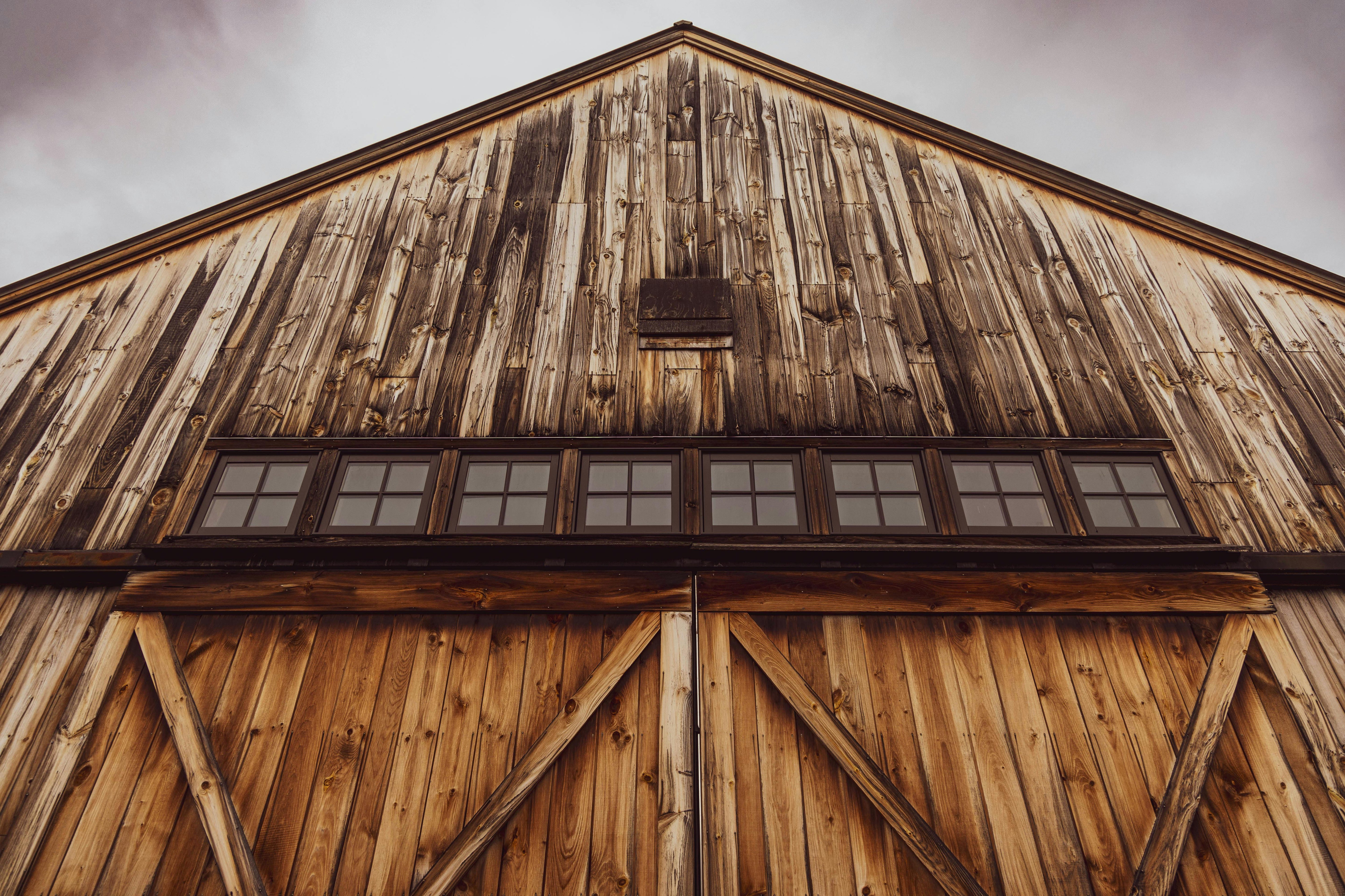 Historic Midwestern barn with reclaimed wood siding used for salvaged hardwood timber.